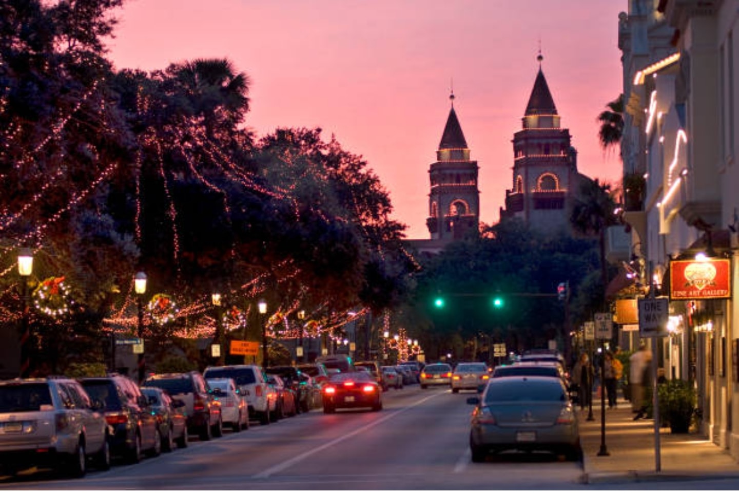Riverside city skyline illuminated at night
