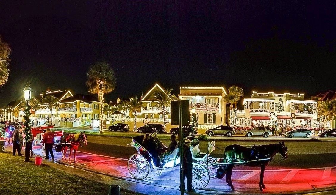 Horse-drawn carriage at night in colonial town square